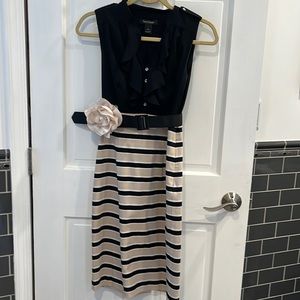 Stunning stretchy sexy but classy dress. Excellent condition. Belt/flower option